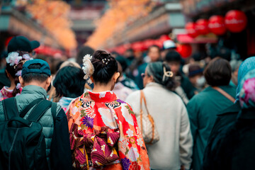 Young girl wearing Japanese kimono standing in front of Sensoji Temple in Asakusa Tokyo, Japan. Kimono is a Japanese traditional garment."kimono"