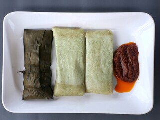 Buras is a typical food from the Banjar Tribe of South Kalimantan which is made from nasi lemak wrapped in banana leaves and peanut chili sauce.