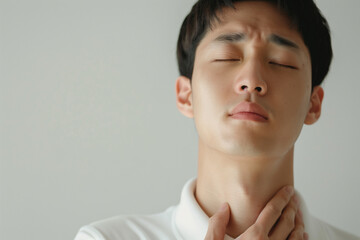Man Touching Throat Experiencing Discomfort