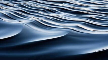 Close-up of smooth water ripples forming abstract wave patterns