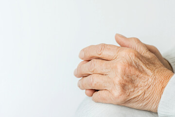Close-Up of Elderly Woman's Hands Resting in Lap