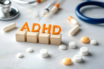 ADHD Concept Displayed with Pills and Wooden Letters