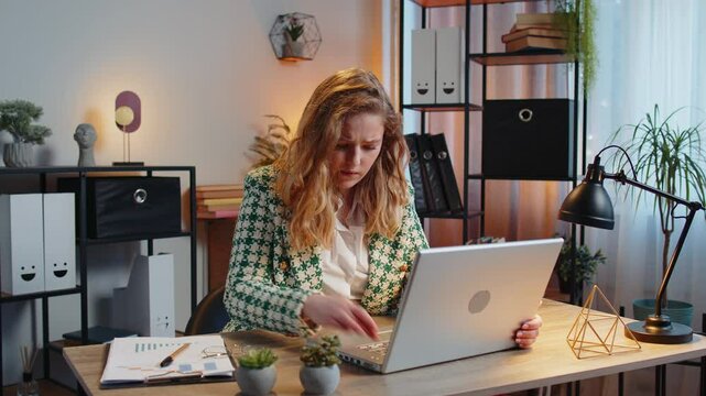Frustrated businesswoman having software problems with laptop, angry woman get nervous seeing error or mistake notification at computer screen, mad employee experience virus attack or app malfunction.