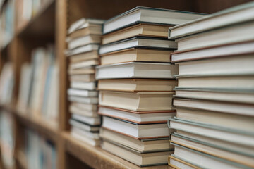 Fototapeta premium Stack of Books Organized on a Shelf