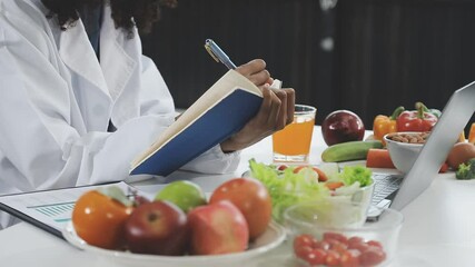 Nutritionist giving consultation to patient with healthy fruit and vegetable, Right nutrition and diet concept