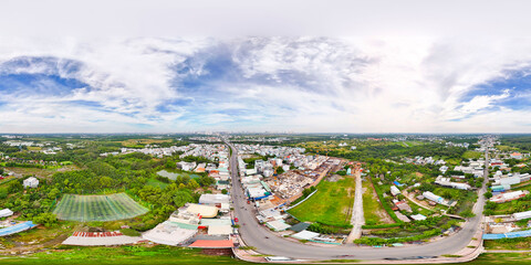 Fototapeta premium Aerial view of Thu Duc city 2024, Ho Chi Minh city-Vietnam with apartment and building real estate projects, river. Aerial view of Saigon city with blue sky and sun. Fly-cam landscape 