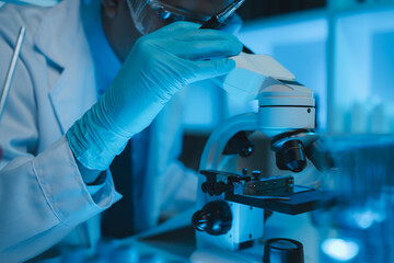 lab, scientist working on scientific equipment in modern laboratory, International team of...