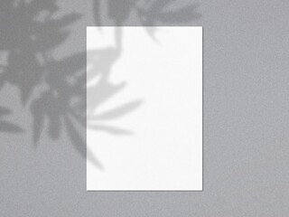 vertical sheets of textured white paper on soft gray table background. Mockup overlay with the plant shadows.