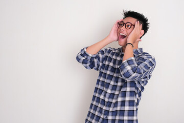 A man looking to the right direction with surprised face expression