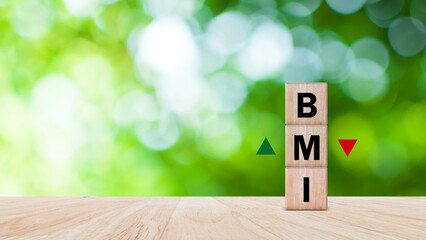 BMI big mac index symbol, Concept words BMI big mac index on wooden cube, Medicine and Body Mass...