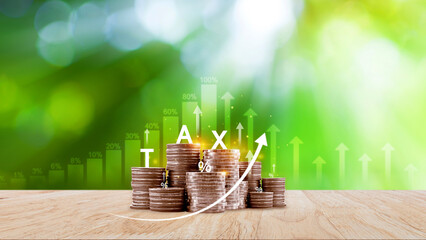 Tax concept. Income tax, savings, stack of coins represent the concept of tax return preparation...