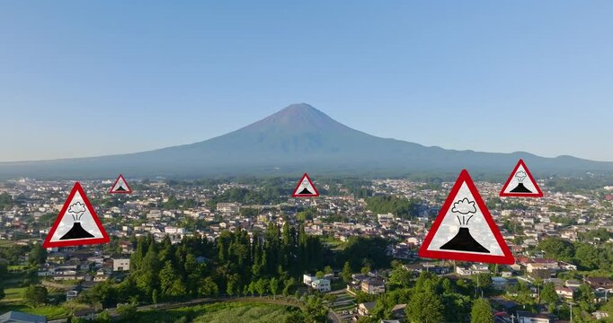 AERIAL: 3D rendered warning signs on a town with Volcano mountain background