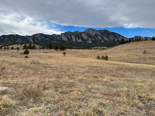 Obraz premium Cloudy winter meadow and Flatirons, Boulder, Colorado,mountains,Rocky mountains