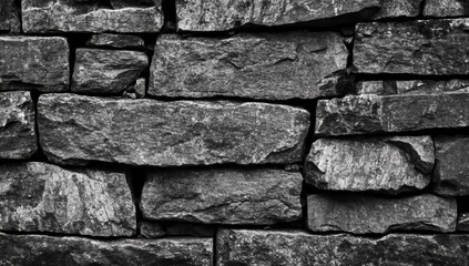 Textured black stone wall background with seamless design, perfect for various uses