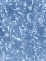 Background of winter snow texture. Small ice crystals on surface of snow natural background