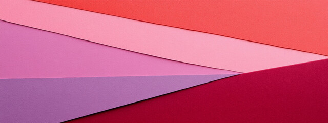 Colorful background with pink, red, and purple paper layers creating vibrant design