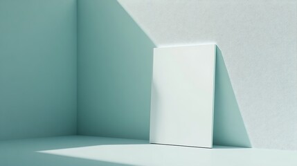 Fototapeta premium Blank white canvas mockup in a minimalist light teal room.