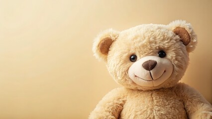 Obraz premium A smiling beige teddy bear, a plush delight. Soft toy photography against a light background.