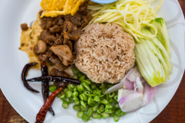 Thai cuisine. Mixed cooked rice with shrimp paste sauce. Top view
