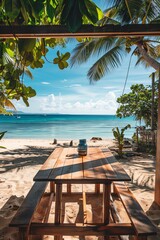 A wooden table on a beach with a beautiful view of the ocean. The table is set for two people.