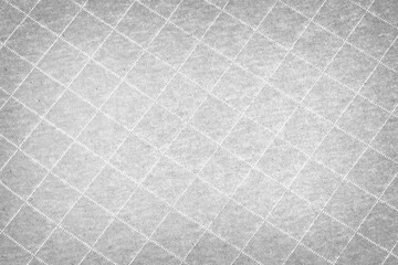 Gray fabric with diamond stitching pattern texture background