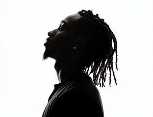 Artistic representation of a black man in profile against white.