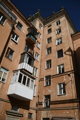Architecture of old Soviet Union houses in Stalin's Empire style. Exterior of the facade of a vintage residential building in Russia