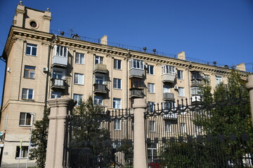Architecture of old Soviet Union houses in Stalin's Empire style. Exterior of the facade of a vintage residential building in Russia