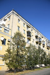 Architecture of old Soviet Union houses in Stalin's Empire style. Exterior of the facade of a vintage residential building in Russia
