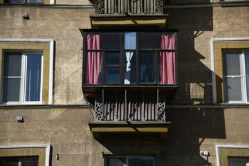 Architecture of old Soviet Union houses in Stalin's Empire style. Exterior of the facade of a vintage residential building in Russia