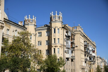 Fototapeta premium Architecture of old Soviet Union houses in Stalin's Empire style. Exterior of the facade of a vintage residential building in Russia