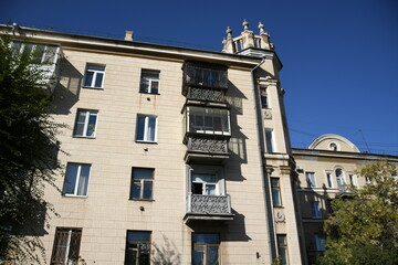 Obraz premium Architecture of old Soviet Union houses in Stalin's Empire style. Exterior of the facade of a vintage residential building in Russia