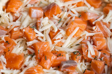 Fish tart. Piece of french pie with salmon and cheese. Quiche lauren with fish. Close-up top view