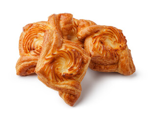 Freshly baked pastries arranged on a white surface in a bright kitchen setting during morning hours