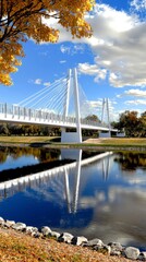 Naklejka premium Stunning Cable Stayed Bridge Reflection Autumn Scenery River Sky