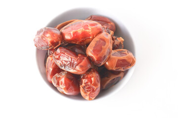 Kurma dried date palm fruits, Ramadan food which eaten in fasting month for Muslim. Pile of fresh dried date fruits in a bowl.