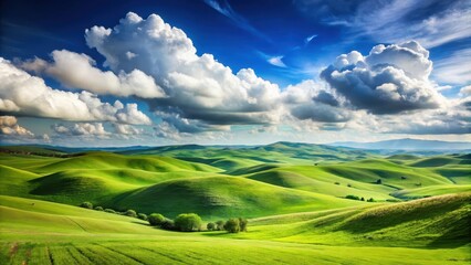Obraz premium Serene landscape of rolling green hills under a bright blue sky with scattered clouds, scenic, tranquil, peaceful, countryside