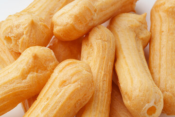 Delicious golden pastries arranged neatly on a white background ready for indulgence or serving at a gathering