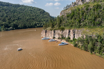 Southern Urals, Bashkortostan, Nugush reservoir: pleasure crafts near the cliffs at the confluence...