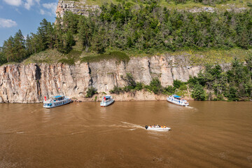 Southern Urals, Bashkortostan, Nugush reservoir: pleasure crafts near the cliffs at the confluence...