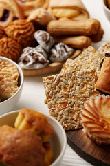 Delightful assortment of freshly baked goods displayed on a wooden table for a festive gathering