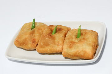 Martabak is a popular Indonesian street food. Martabak are fried pancakes or crepes and are usually filled with beaten eggs, chopped spring onions, carrots, potatoes and minced meat.