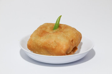 Martabak is a popular Indonesian street food. Martabak are fried pancakes or crepes and are usually filled with beaten eggs, chopped spring onions, carrots, potatoes and minced meat.