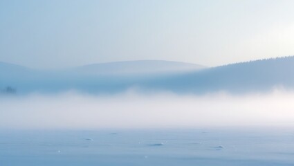 Fototapeta premium Misty Mountains Enveloping a Snowy Lake
