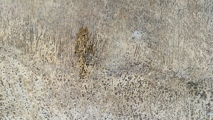 Abstract Textured Cement Floor Surface with Scratched and Stained Pattern in Neutral Colors