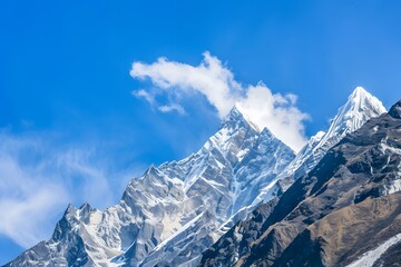 Obraz premium Serene mountain landscape with snow-capped peaks and a river winding through the valley.