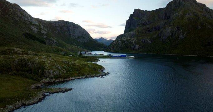 Fish factory of salmons in fjord, Sortland in Norway. Aerial forward