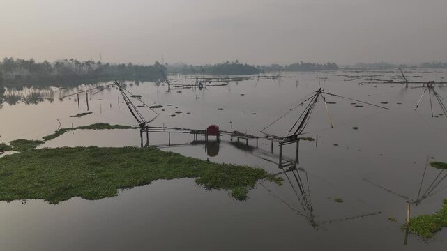 Chinese fishing nets or cheena vala are a type of stationary lift net, Chellanam Harbour is a fishing harbor in Kerala, India