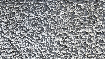 Rough white cement wall texture, rough surface, colored texture on cement background, antique wall texture through time.