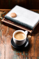 Cup of coffee on wooden background. Close up	